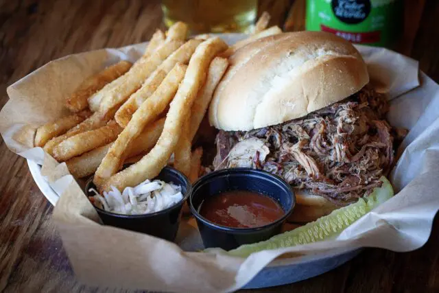 Eckert's Restaurant Pulled Pork Sandwich with french fries and sauce on the side