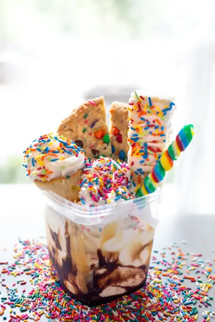 4 scoops of custard, cupcake, lolipop. rice krispie treat and more