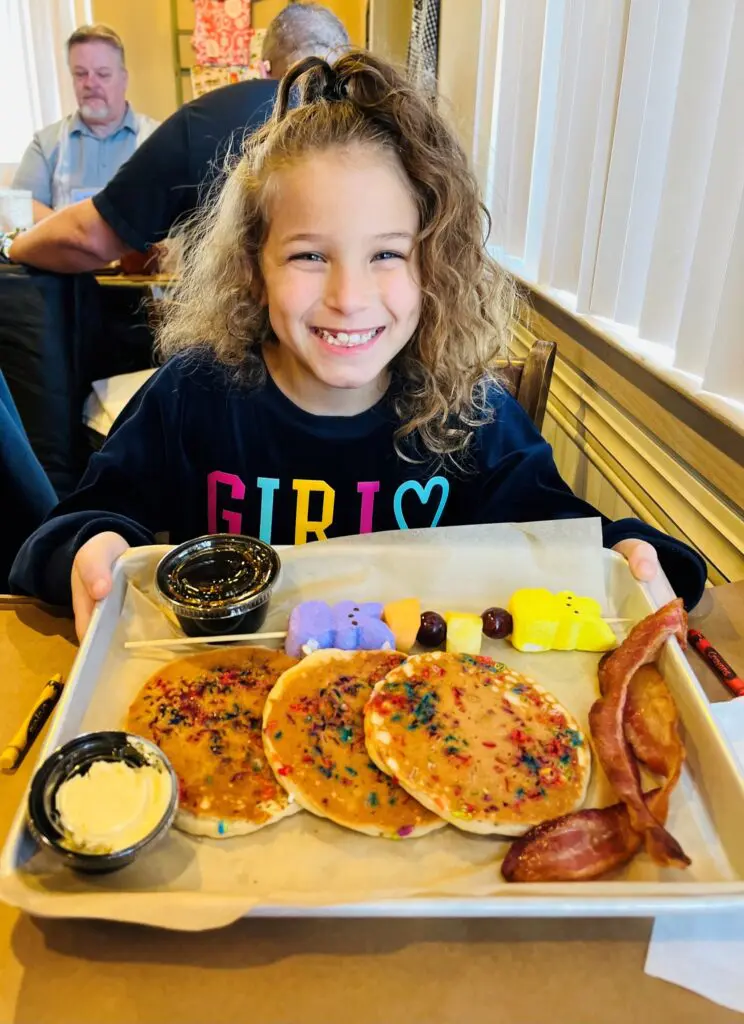 Flippity Flop Breakfast- little girl with pancakes, bacon and fruit