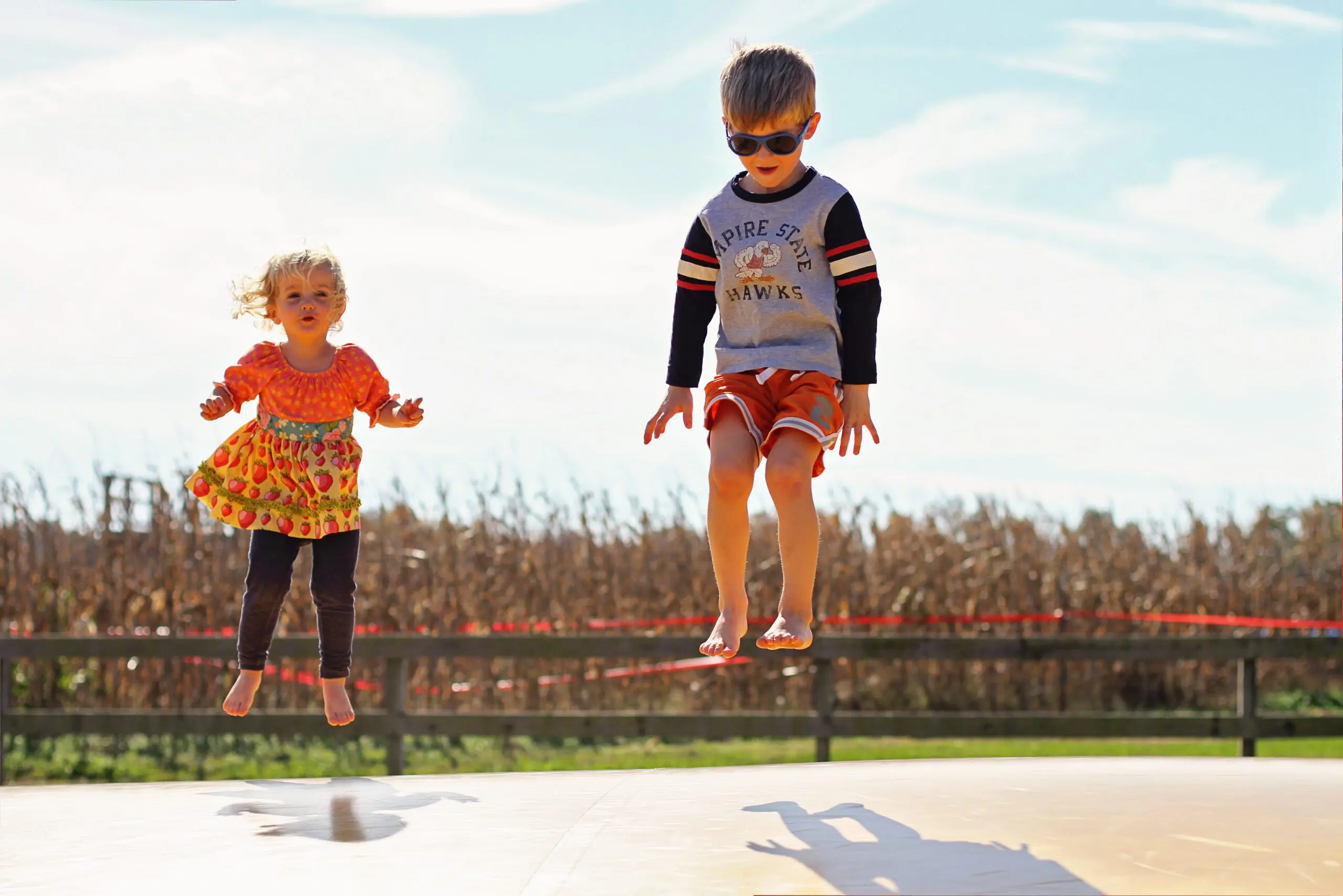 Two children on Jumping Pillow at Millstadt Farm.