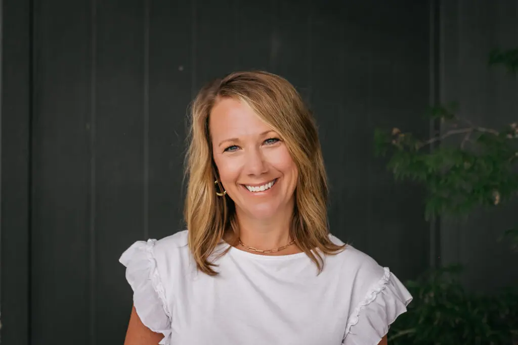 Amanda Morgan, Marketing Director. Wearing White Shirt Close Up