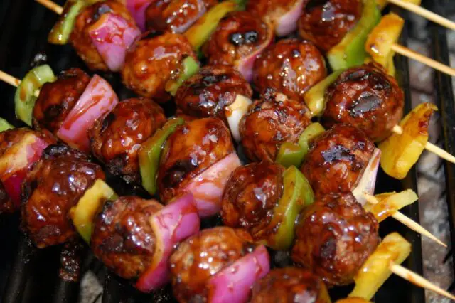 A picture of kebabs on the BBQ