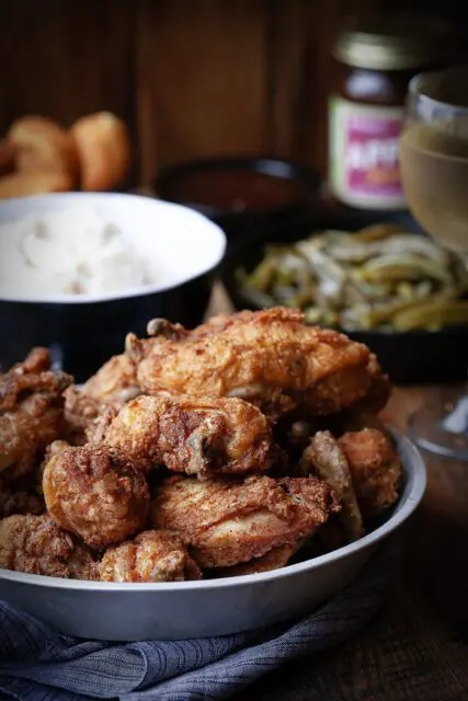 fried chicken dinner on table at Eckert's restaurant with green beans and mashed potatoes