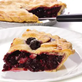 Blackberry pie sliced and plated.