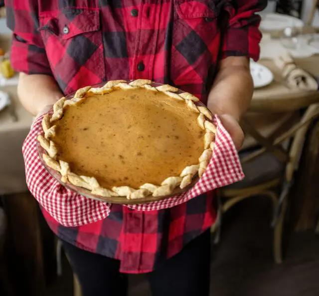 Woman holding a fresh baked pie