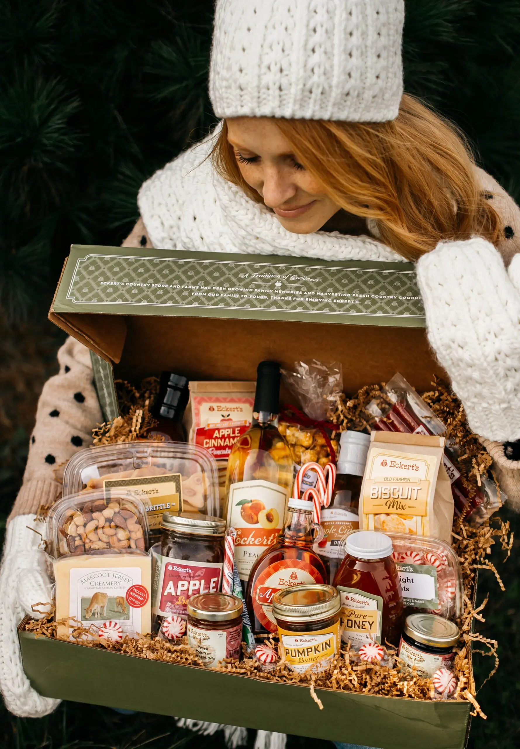 Gift Basket with assortment of Eckert's products in a box with women holding.