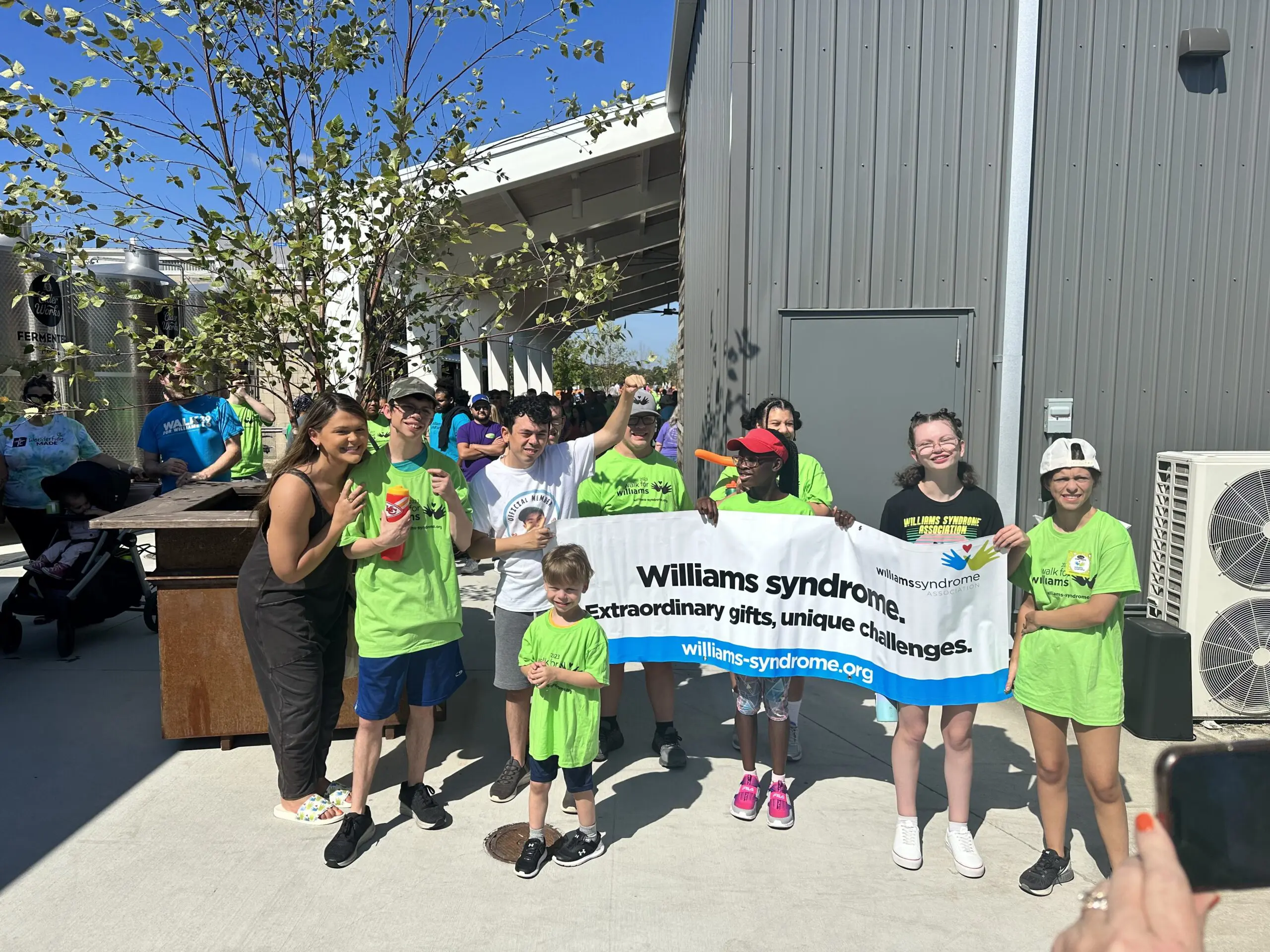 Walk for Williams Syndrome - Grace, Joey and children with banner near Cider Shed