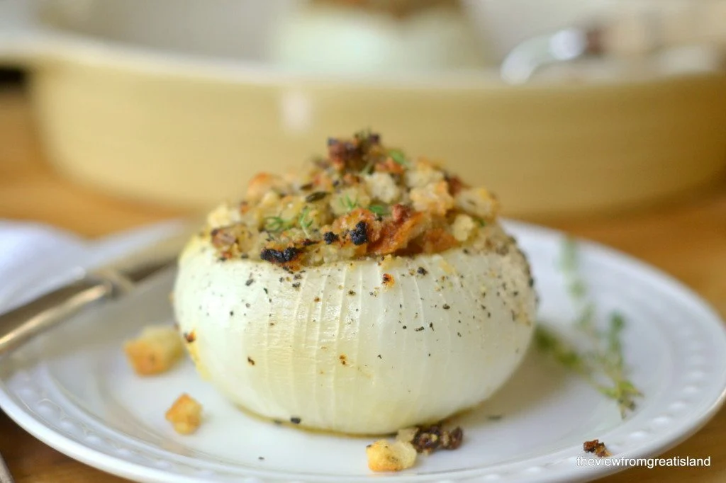 Baked Stuffed Onion on white plate.
